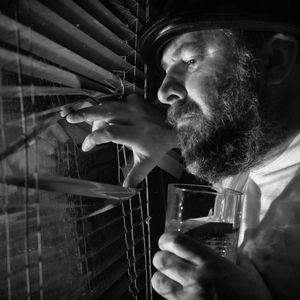 Abstract shadows of person stretching near a window.